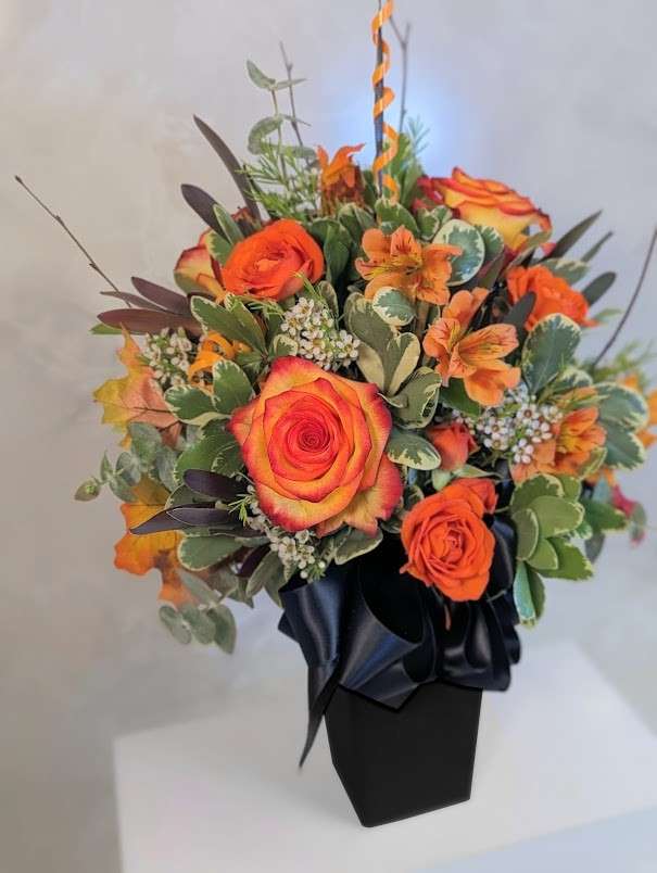 Which dark-colored flowers work best for Halloween?