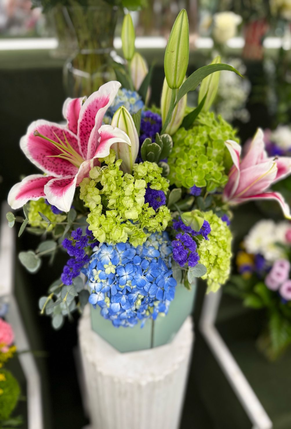 AQUA BLUE GARDEN ARRANGEMENT IN THE COOLER