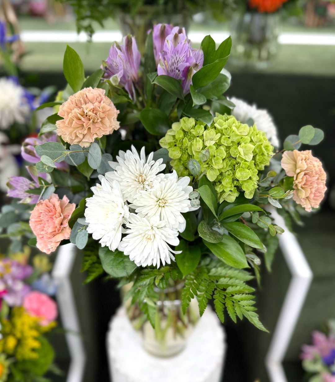 LIGHT PASTEL ARRANGEMENT IN THE COOLER
