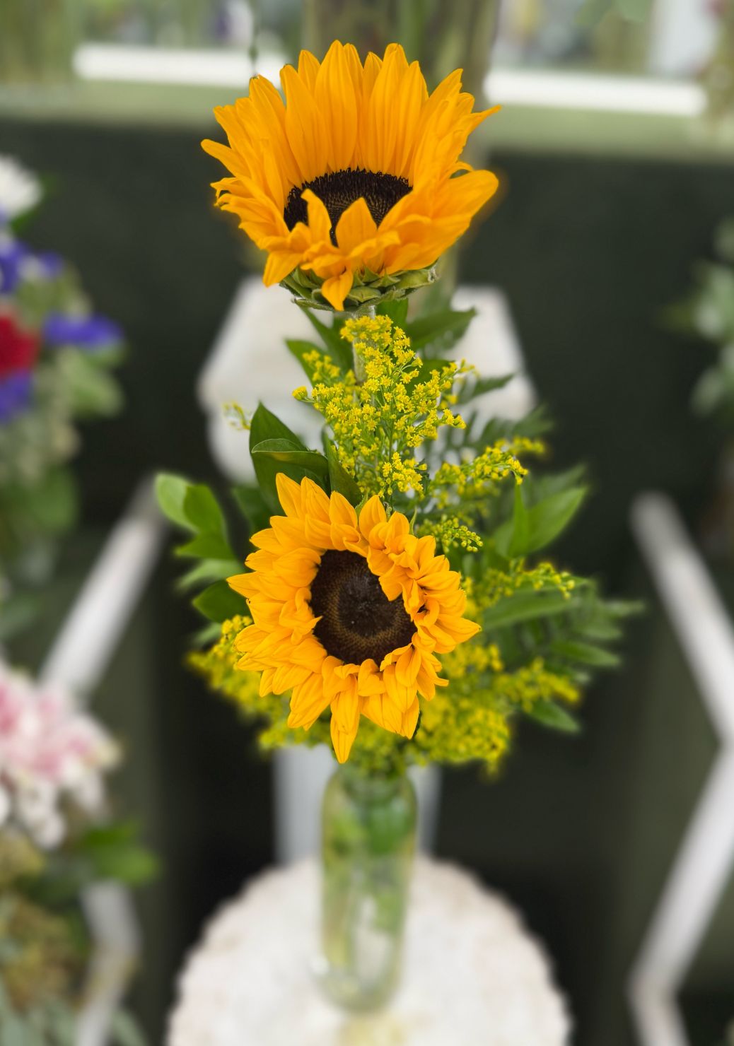 DOUBLE SUNFLOWER BUDVASE ARRANGEMENT IN THE COOLER