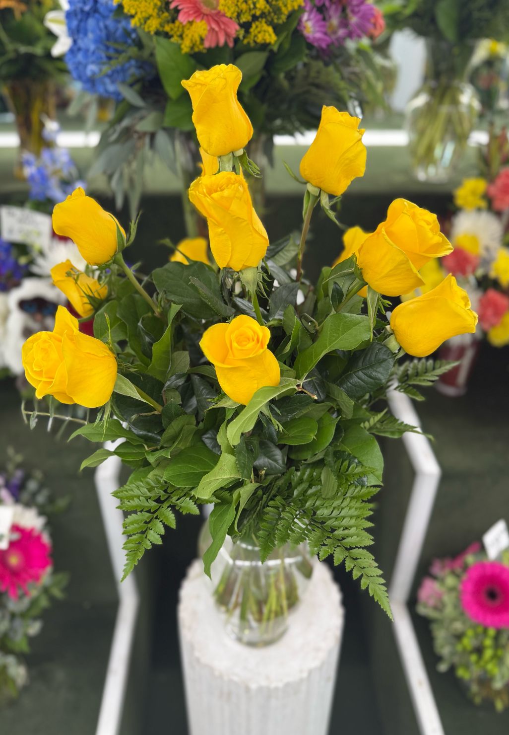 DOZEN YELLOW ROSE ARRANGEMENT IN THE COOLER