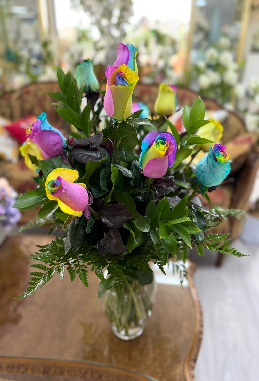 DOZEN RAINBOW ROSES ARRANGEMENT IN THE COOLER