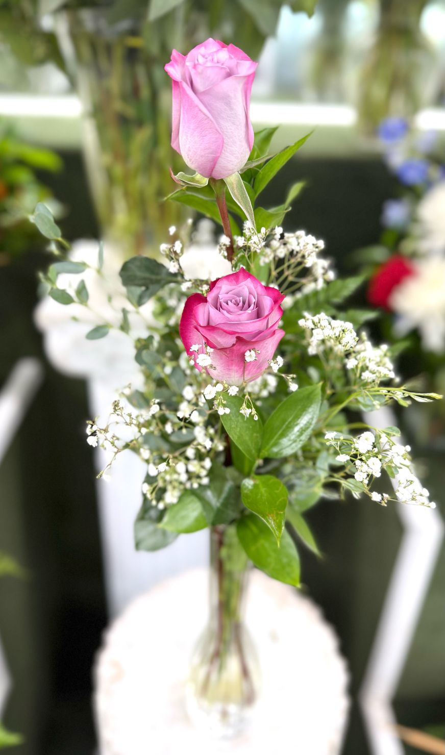Double Lavender Rose Budvase Arrangement In the Cooler