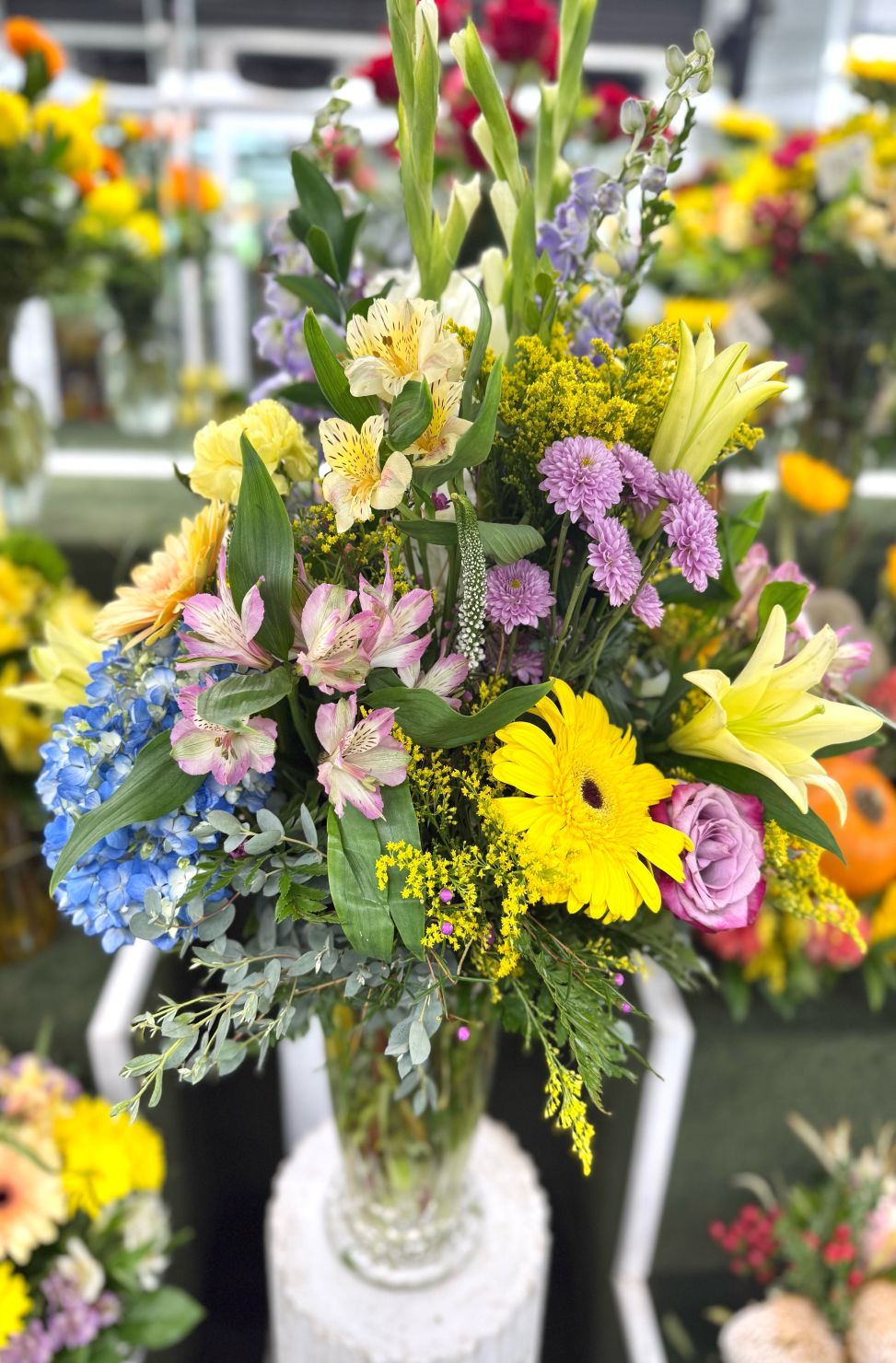 Tall Bloom Burst Arrangement In the Cooler