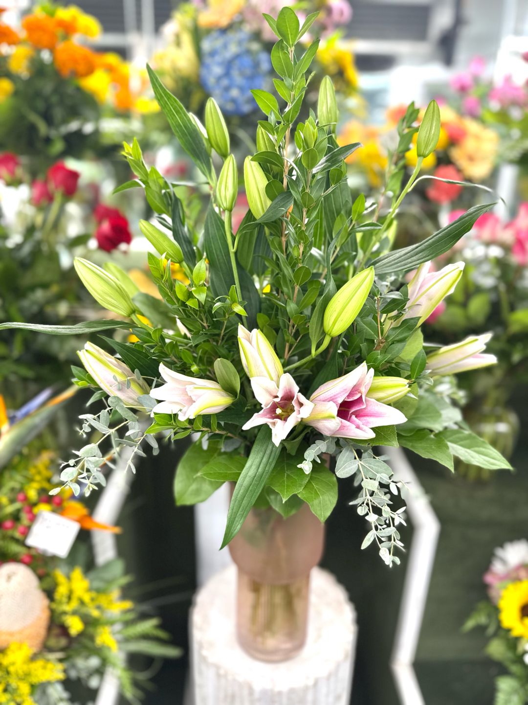 Lillies Tall Pink Frosted Vase Arrangement In the Cooler