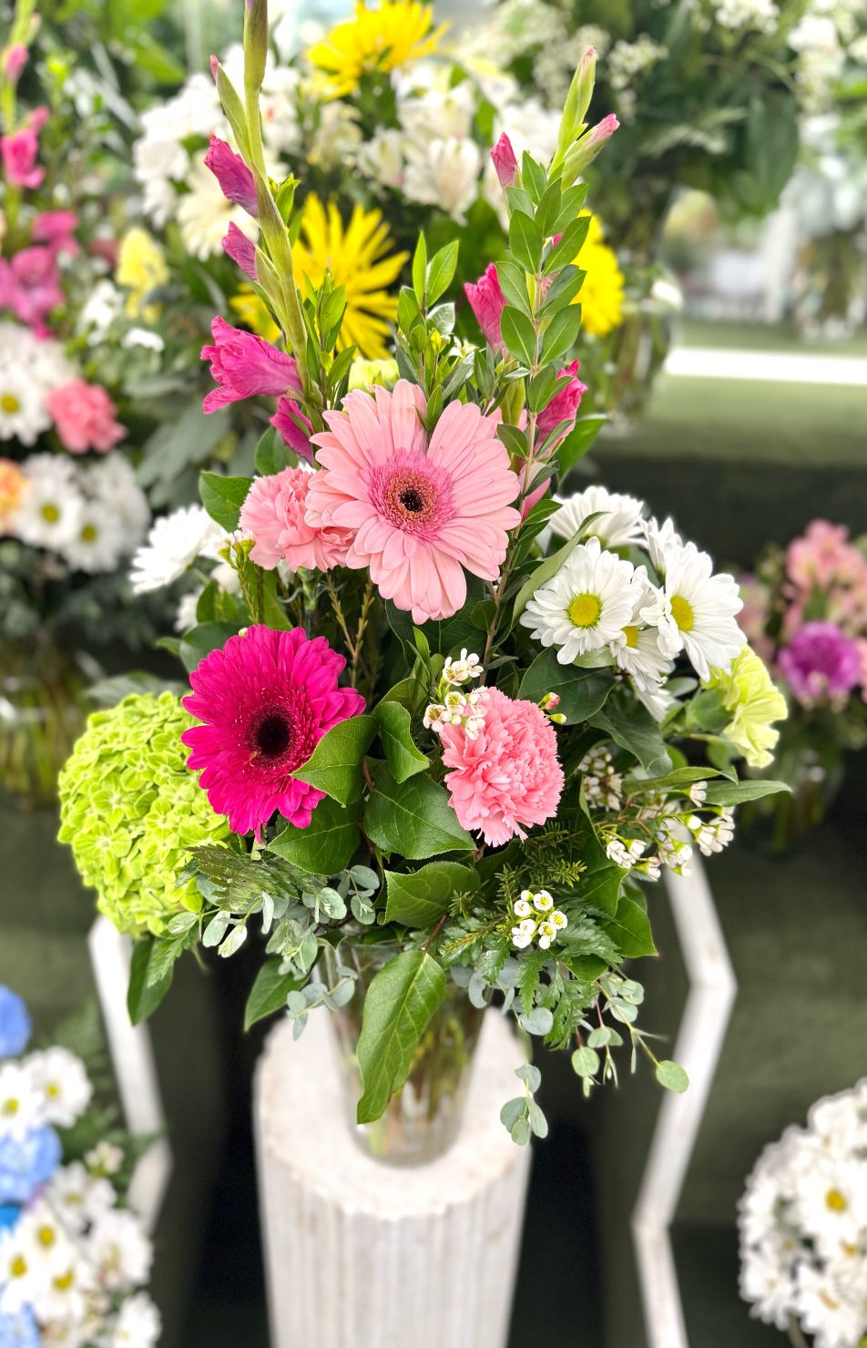 Bright Beginnings Arrangement In the Cooler