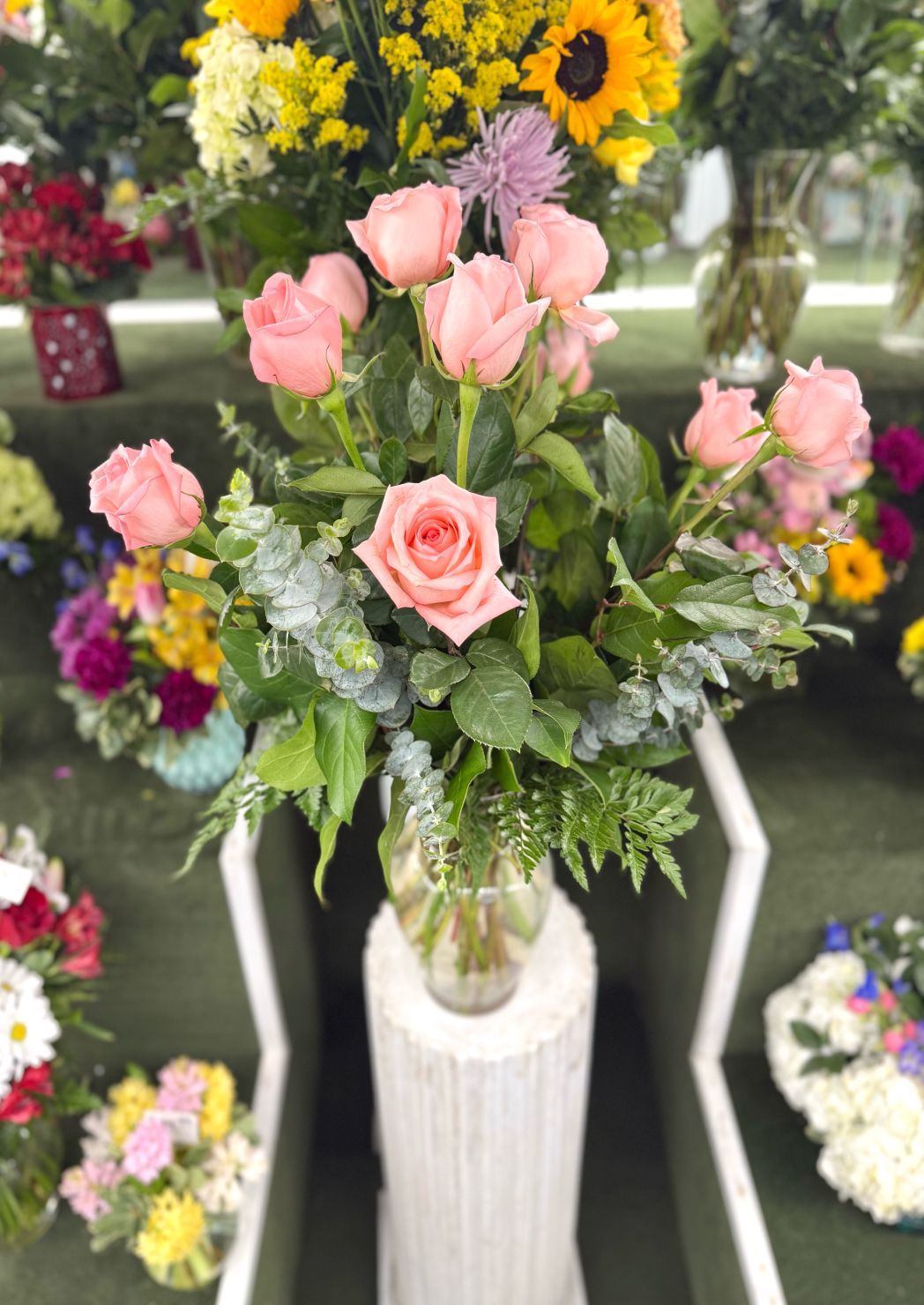 Pretty Pink Dozen Roses Arrangement In the Cooler