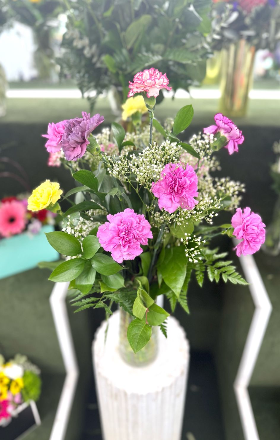 Dozen Colorful Carnations Arrangement In the Cooler