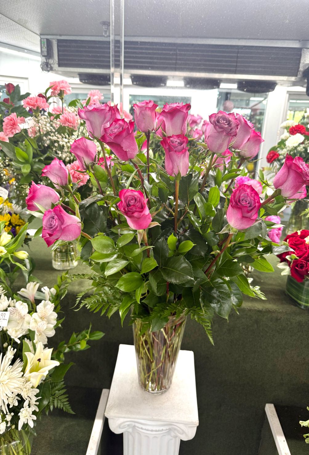 Two Dozen Lavender Roses Arrangement In the Cooler