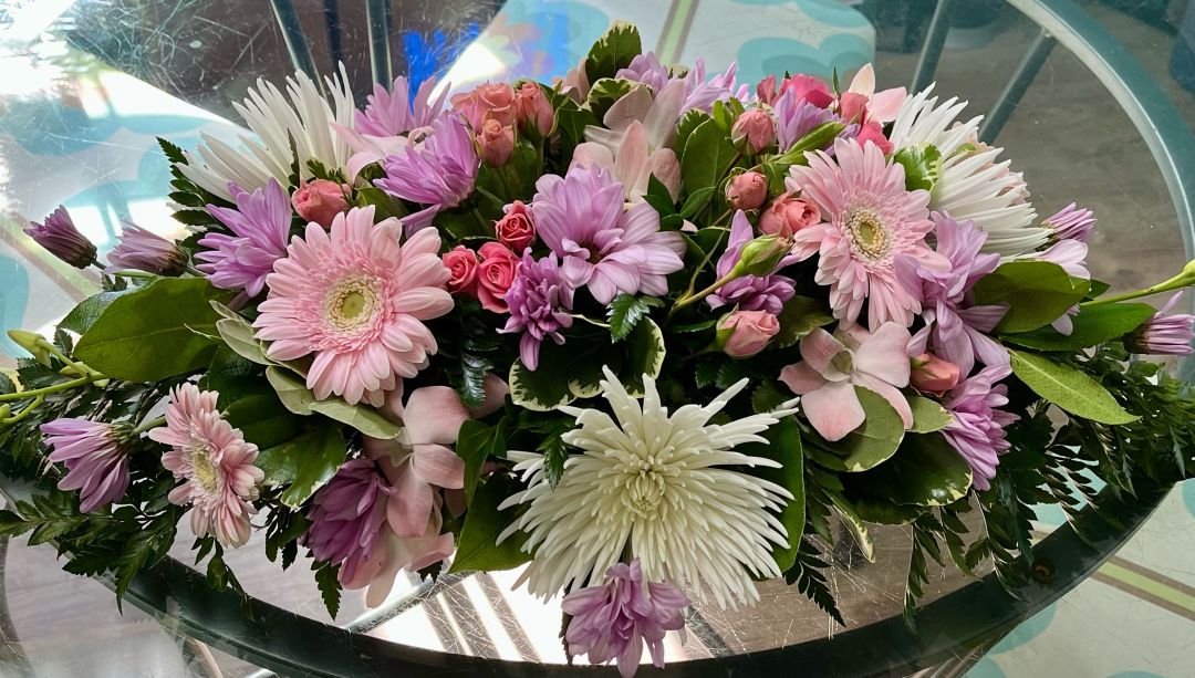 Spring has sprung in Newtown Designer’s choice oval centerpiece 