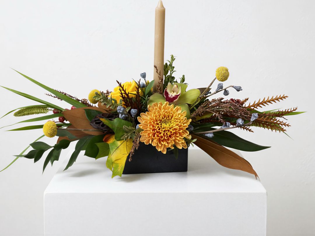 Harvest holiday centerpiece with candle