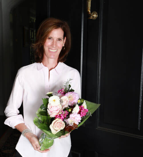 Woman receives monthly flower subscription by The Flower Bar