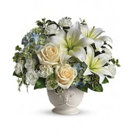 My Lady's Florist Westland - Soothing and respectful. Calm and compassionate. This beautiful collection of white and light colored blossoms will deliver your loving thoughts perfectly.