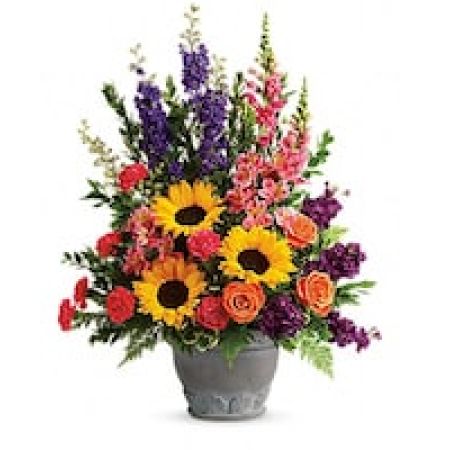 My Lady's Florist Westland - A colorful reminder that brighter days are ahead, this uplifting arrangement of sunflowers and roses in an elegant large antiqued pot brings joy and hope.\n