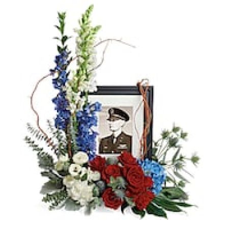 My Lady's Florist Westland - Honor the memory of an always-beloved with this beautiful display bouquet. Designed to surround a favorite photo, its patriotic mix of blue hydrangea with red and white roses is a respectful tribute.\n