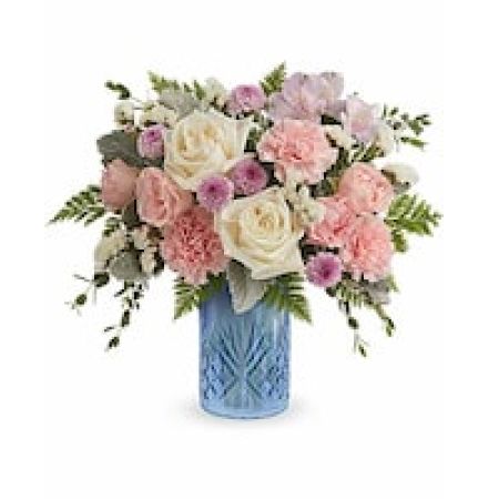 My Lady's Florist Westland - The Blue Belle Bouquet is a sweet Mother's Day flower arrangement of soft pink, white, and lavender blooms, beautifully presented in the Blue Belle Vase keepsake-perfect for celebrating Mom with fresh spring charm.