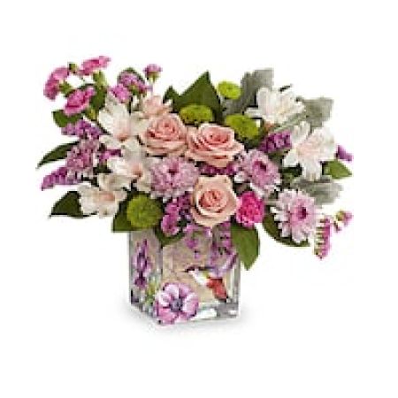 My Lady's Florist Westland - Sweet as a hummingbird flitting through a garden, this pretty pink rose bouquet looks lovely in a vintage-inspired cube vase.