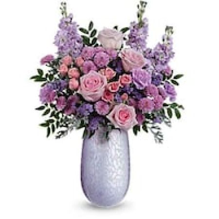 My Lady's Florist Westland - What a treat! Overflowing with pink roses and lavender blooms, this stunning Mother's Day bouquet is artfully arranged in the hand-blown iridescent glass Vivi vase-a keepsake Mom will treasure.