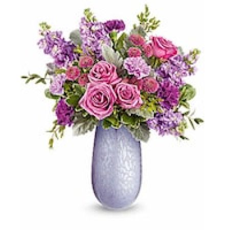 My Lady's Florist Westland - Capture Mom's heart with the Vivi vase, crafted from hand-blown art glass with an iridescent finish, radiating elegance and charm. Paired with a stunning bouquet of lavender blooms, it's a delightful Mother's Day surprise she'll cherish.