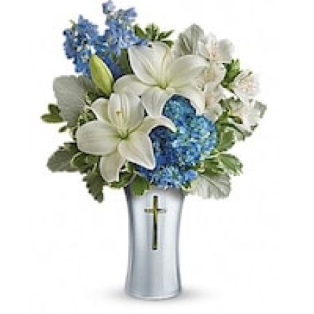 My Lady's Florist Westland - As hopeful as a bright blue sky, this beautiful arrangement of lush blue hydrangea and fragrant white lilies is a heartfelt symbol of peace and beauty. Its reverent, silver-finished ceramic vase with cross cut-out will remain a guiding light to your loved ones for years to come.