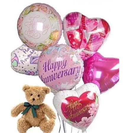 My Lady's Florist Westland - Celebrate love and milestones with our enchanting Balloon Bouquet with Plush! 
This delightful arrangement features vibrant, foil **anniversary balloons** – including a sweet heart shape – radiating joy and affection.
Paired with a cuddly, classic teddy bear, it's a heartwarming gift perfect for saying “Happy Anniversary” or “I Love You”. 
Send this beautiful balloon gift to brighten their day and create a lasting memory filled with warmth and smiles.