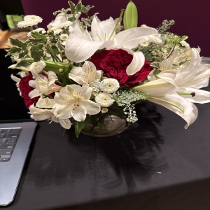 Dottie's Flowers and Plants Los Angeles - A breathtaking blend of romance and sophistication, this stunning bouquet features creamy white lilies, delicate alstroemeria, and rich burgundy roses. Lush greenery complements the blooms, creating a full, fragrant centerpiece perfect for any occasion. Send a timeless expression of love, gratitude, or sympathy with these beautiful fresh flowers. This elegant floral arrangement will fill any space with warmth and grace.