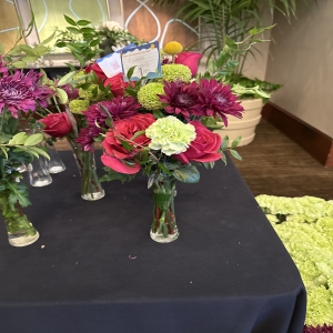 Dottie's Flowers and Plants Los Angeles - Radiant dahlias, roses, and carnations burst with color in this captivating mixed flower bouquet—a stunning blend of deep burgundy, vibrant red, and fresh lime green. Perfect for brightening a room or expressing heartfelt emotions, this arrangement fills any space with a sweet, delicate fragrance. Send this beautiful floral gift to celebrate a special occasion, offer sympathy, or simply show someone you care with the timeless elegance of fresh flowers. A gorgeous and unique centerpiece that brings joy and lasting beauty to any home.