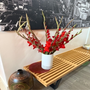 NIgellaSF-Demo San Francisco - Bring sunshine and serenity into any space with 'Glad' a breathtaking arrangement designed to evoke feelings of joy and peacefulness. Towering gladiolus stems create a dramatic silhouette while delicate roses and airy stock add layers of texture and fragrance. This stunning bouquet is a testament to natural beauty perfect for celebrating life's milestones expressing sympathy with grace or simply brightening someone’s day. Imagine the soft blush tones and vibrant purples illuminating a living room or the sweet scent filling a bedside table. 'Glad' is more than just flowers; it’s a heartfelt gesture of love appreciation and remembrance that will be cherished.