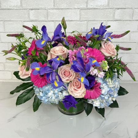 Beaverton Florists- Demo Beaverton - This whimsical and bright spring arrangement is full of iris, hydrangea, Gerber daisy, pink roses, Lusianthus and more fresh spring flowers!