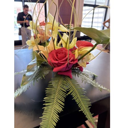 Beaverton Florists- Demo Beaverton - Radiant orchids and a velvety red rose command attention in this striking contemporary floral design, balanced with lush greenery and graceful branches. This unique centerpiece brings a touch of sophisticated warmth to any space, perfect for elevating a special occasion or simply brightening a loved one’s day. Send a bold expression of affection with this unforgettable arrangement – a stunning gift for birthdays, anniversaries, or to show you care. Experience the luxury of fresh flowers delivered with artistry and flair, a truly captivating display of nature’s beauty.