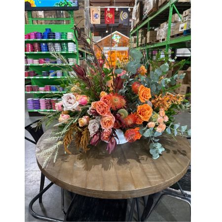 Beaverton Florists- Demo Beaverton - Embrace the warm hues of autumn with this stunning, textured floral design—a captivating blend of burnt orange roses, blush pink blooms, and earthy pincushions. Lush eucalyptus foliage adds a fresh, invigorating scent and graceful movement to this eye-catching centerpiece. Perfect for adding a touch of rustic elegance to your home or as a heartfelt **fall flowers** gift for someone special. Send joy and sophisticated style with this unique **flower arrangement** – a beautiful expression of gratitude, sympathy, or simply ‘thinking of you’.