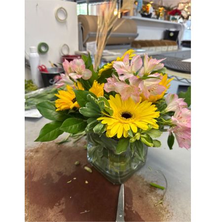 Beaverton Florists- Demo Beaverton - Bathed in the warmth of a summer evening Solstice Radiance is a captivating floral arrangement designed to evoke pure joy and serenity. The blooms a harmonious blend of textures and tones seem to glow with an inner light. Imagine this centerpiece gracing your dining table adding a touch of sophisticated beauty to a special occasion or surprising a loved one with a gift that speaks volumes. Each stem is thoughtfully placed to create a flowing natural aesthetic – a reminder of sun-drenched days and peaceful moments. This arrangement is more than just flowers; it's a burst of sunshine to brighten any space and lift the spirit.