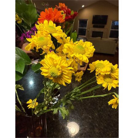 Beaverton Florists- Demo Beaverton - Bring the warmth and joy of a summer afternoon indoors with our Sunlit Meadow arrangement. This stunning bouquet captures the feeling of golden sunlight filtering through a field of wildflowers. Delicate textures and a natural garden-fresh style create a sense of effortless beauty perfect for brightening any space. Imagine this arrangement gracing your dining table adding a touch of relaxed elegance to a casual gathering or expressing your deepest sympathy with a comforting and heartfelt gesture. This is more than just flowers; it's a moment of sunshine delivered to their door.