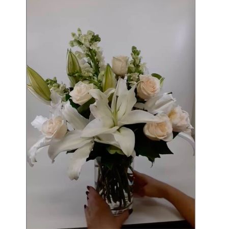 Beaverton Florists- Demo Beaverton - Bring the warmth and radiance of a summer afternoon indoors with Sunlit Meadow. This captivating arrangement evokes the feeling of strolling through a field bathed in golden light. Soft billowing blooms in shades of peach apricot and cream create a harmonious blend of texture and color accented by delicate greenery. Imagine this exquisite bouquet adorning your dining table adding a touch of effortless beauty to a special meal or surprising a loved one with a gesture that truly speaks from the heart. Sunlit Meadow is more than just flowers—it’s a moment of serenity a celebration of life’s simple pleasures and a perfect expression of joy and gratitude. This flower arrangement is ideal for birthdays anniversaries or simply to brighten someone’s day.