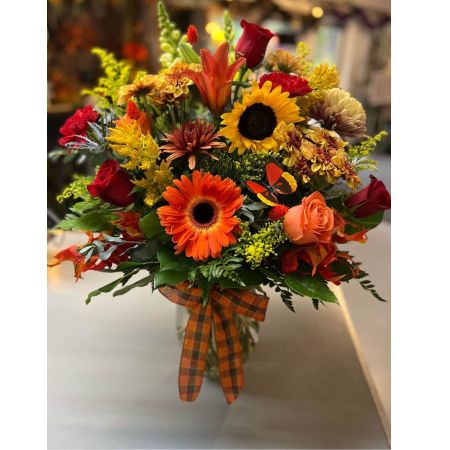 Beaverton Florists- Demo Beaverton - Embrace the warmth and beauty of the autumn season with our 'Fall Special' arrangement. This stunning bouquet captures the rich earthy tones and cozy feelings of fall in full bloom. Imagine a vibrant cascade of color brightening a dining table offering comfort on a chilly evening or sending a heartfelt 'thinking of you' to someone special. The arrangement features a luxurious blend of textures – the delicate petals of roses the cheerful fullness of mums the rustic charm of sunflowers and the unique shape of alstroemeria. Each stem is carefully selected to create a harmonious and inviting display that evokes the scent of crisp air and golden leaves. Perfect as a centerpiece a housewarming gift or simply to celebrate the beauty of the season. Bring the outdoors in and let the 'Fall Special' arrangement fill your space with autumnal joy.