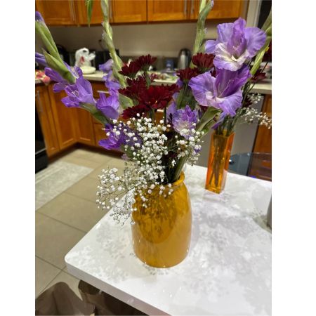 Beaverton Florists- Demo Beaverton - Bathed in the warmth of a summer sunset Sunstone Radiance is a captivating floral arrangement designed to bring a touch of golden elegance to any space. Imagine the soft glow of these blooms illuminating a bedside table adding a comforting and peaceful ambiance to a quiet evening. The delicate petals seem to whisper stories of long sun-drenched days and joyful gatherings. This isn’t just a bouquet; it’s a feeling of warmth gratitude and cherished moments perfect for expressing sympathy celebrating a milestone or simply brightening someone’s day with a spontaneous gift of beauty. Let Sunstone Radiance fill a room with its gentle presence and remind the recipient of the radiant joy life holds.