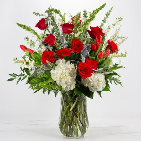 Beaverton Florists- Demo Beaverton - Experience love at its peak with our stunning Infinity arrangement, designed to elevate any moment into a grand romantic gesture. This breathtaking ensemble features classic blooms in passionate shades of red, pure white, and lush green, meticulously arranged by our skilled designers in an elegant tall footed vase.</br>
Make a lasting impression and express your love in style with Infinity. Plus, enjoy same-day flower delivery for added convenience and spontaneity in sharing your affection.
Our showstopper collection pieces are meticulously crafted to captivate with their impressive size and exquisite design, ensuring they leave a lasting impression.
Size: 17 x 17 x 24

Stems Included: Hydrangeas | Roses|Tulips|Stock
