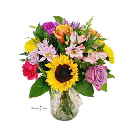 Beaverton Florists- Demo Beaverton - Bring the joy of a sun-drenched meadow indoors with our ‘Spring Bouquet’ – a vibrant explosion of color and fresh floral fragrance. Sunflowers, roses, lilies, and carnations dance together in a delightful mix of yellows, pinks, purples, and reds, creating a truly captivating centerpiece. Perfect for brightening someone’s day or celebrating life’s special moments, this stunning arrangement radiates warmth and positivity. Order this beautiful **fresh flower delivery** today and share the gift of spring!