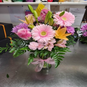 Demo Florists-13 Coppell - Bring the warmth and joy of the season into any home with 'Holiday' a stunning floral arrangement designed to capture the spirit of festive cheer. Imagine the delicate fragrance filling a room a comforting blend of pine and sweet blooms. This luxurious bouquet features a harmonious mix of textures and colors reminiscent of a winter wonderland. It’s perfect as a centerpiece for your own table or to send a heartfelt message of love and goodwill to someone special during the holidays. 'Holiday' isn't just a gift of flowers it’s a gesture of warmth beauty and lasting memory.