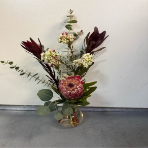 Almy's Florist San Bernardino - Bathed in the warm glow of a summer afternoon Sunlit Reverie is a captivating floral embrace. Imagine this arrangement gracing your dining table filling the room with its delicate fragrance and cheerful presence. Soft petals dance in a symphony of color evoking feelings of peace and tranquility. This isn’t just a bouquet; it’s a moment of sunshine brought indoors – perfect for celebrating life’s simple joys expressing heartfelt gratitude or simply indulging in a little self-care.  Send a touch of radiant beauty to someone special and let them bask in the warmth of this stunning display.