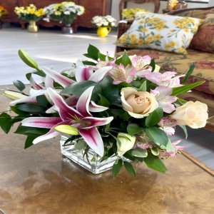 Almy's Florist San Bernardino - Embrace the understated beauty of 'Brittany' a captivating flower arrangement designed to evoke feelings of peaceful serenity and joyful connection. This stunning bouquet features a harmonious blend of soft textures and delicate blooms creating a truly unforgettable gift or a beautiful addition to your own home. Imagine the gentle fragrance filling a room the airy lightness lifting spirits and the subtle hues adding a touch of refined elegance to any space. 'Brittany' is more than just flowers; it's a whisper of thoughtfulness a warm embrace in bloom perfect for expressing sympathy celebrating a new beginning or simply brightening someone's day. The arrangement is expertly crafted to showcase the natural beauty of each stem ensuring a lasting impression and a moment of pure floral delight. This exquisite piece is perfect for a bedside table a dining room centerpiece or to send a loving message to someone special.