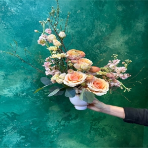 Almy's Florist San Bernardino - Indulge in the sweet serenity of 'Peach Pie' a truly captivating floral arrangement designed to evoke warmth and joy. Imagine the soft glow of a summer sunset captured in a bouquet – that’s the feeling this piece embodies. Lush blooms reminiscent of ripe peaches and creamy vanilla create a harmonious blend of texture and color. Delicate roses unfurl alongside fragrant stock and playful ranunculus offering a captivating scent that will gently perfume any room. 'Peach Pie' isn’t just flowers; it’s a moment of bliss a token of affection or a stunning centerpiece for your own table. Perfect for birthdays anniversaries or simply to brighten someone’s day this arrangement speaks volumes without saying a word. Send the gift of sunshine with 'Peach Pie'.