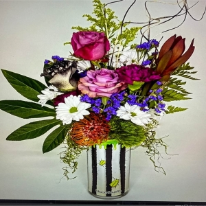 Almy's Florist San Bernardino - Bring the warmth and radiance of a summer afternoon indoors with Sunlit Meadow. This lush arrangement is a captivating blend of textures and tones evoking the feeling of a stroll through a field bathed in golden light. Delicate petals unfurl in a harmonious dance creating a piece that feels both wild and refined. Imagine this bouquet gracing your dining table lifting spirits with its cheerful presence or as a thoughtful gift to brighten someone’s day. Sunlit Meadow is more than flowers; it’s a moment of sunshine carefully crafted to inspire joy and lasting memories.