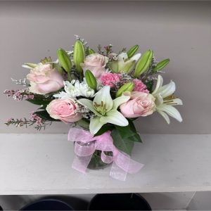 Lakeland Flowers Lakeland - Evoke a sense of tranquil beauty with ‘Deer’ a wildflower-inspired arrangement designed to bring the serenity of a forest meadow into any space. Soft cascading blooms mimic the gentle grace of a deer as it moves through dappled sunlight. Imagine this piece gracing your dining table adding a touch of organic elegance to a special occasion or sending warmth and compassion to someone experiencing a quiet moment. 'Deer' is a thoughtful expression of sympathy gratitude or simply a desire to brighten someone’s day with the understated charm of nature's palette. The arrangement possesses a delicate fragrance hinting at fresh air and blooming fields and its natural slightly wild aesthetic makes it a perfect complement to any home décor. This isn’t just a bouquet; it’s a piece of peace.