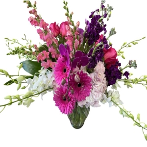 Lakeland Flowers Lakeland - Bathed in the warm embrace of a fading sun Sunset Serenade is a luxurious floral arrangement designed to evoke feelings of peace and contentment. This stunning bouquet features a harmonious blend of textures and hues reminiscent of a summer evening sky. Imagine the soft glow of these blooms brightening a cherished corner of your home or the joy on a loved one's face as they receive this captivating gift. Each stem is carefully selected for its freshness and vibrancy creating a truly unforgettable experience. Perfect for expressing sympathy celebrating a milestone or simply adding a touch of elegance to any occasion Sunset Serenade speaks volumes without saying a word.