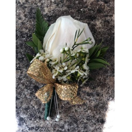 Flowers By Fairytales  - This boutonniere features a rose adorned with wax flower and greens. Customers may choose the colors of the ribbon and flowers.