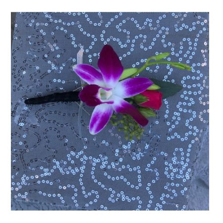 Flowers By Fairytales Elk Grove - This boutonniere contains a rose and an orchid. Customers may choose the colors of the flowers and ribbon.
