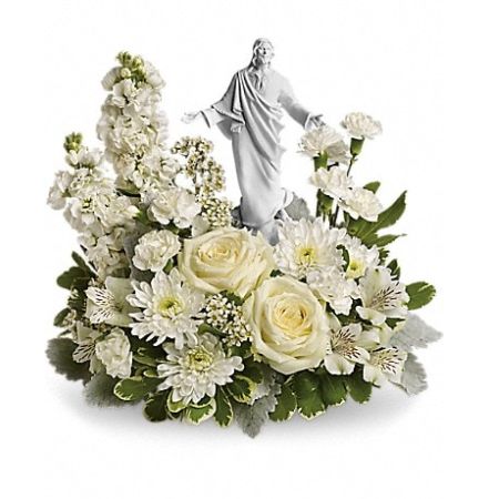 The Flower Box Kingsville - An elegant display of faith and grace, this beautiful arrangement will comfort the bereaved in a truly thoughtful and respectful way. An exquisite sculpture of Jesus is surrounded by a bed of lovely blossoms. It is sure to be appreciated and always remembered.