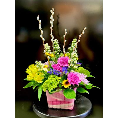 Fortin Gage Nashua - A delightful spring surprise of fresh cut blooms delicately arranged in a pink berry basket! 