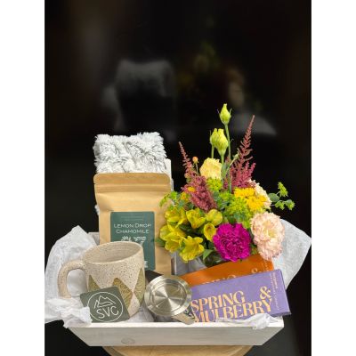 Fortin Gage Nashua - Looking to send comfort to a friend or employee? The comfort crate is curated to do just that. 

Say good bye to fruit baskets and send them long lasting comfort.

Includes : Mini floral arrangement, two premium chocolate bars, NH Made Loose Leaf Tea with strainer, NH hand made mug, and a Warmies heatable neck wrap 